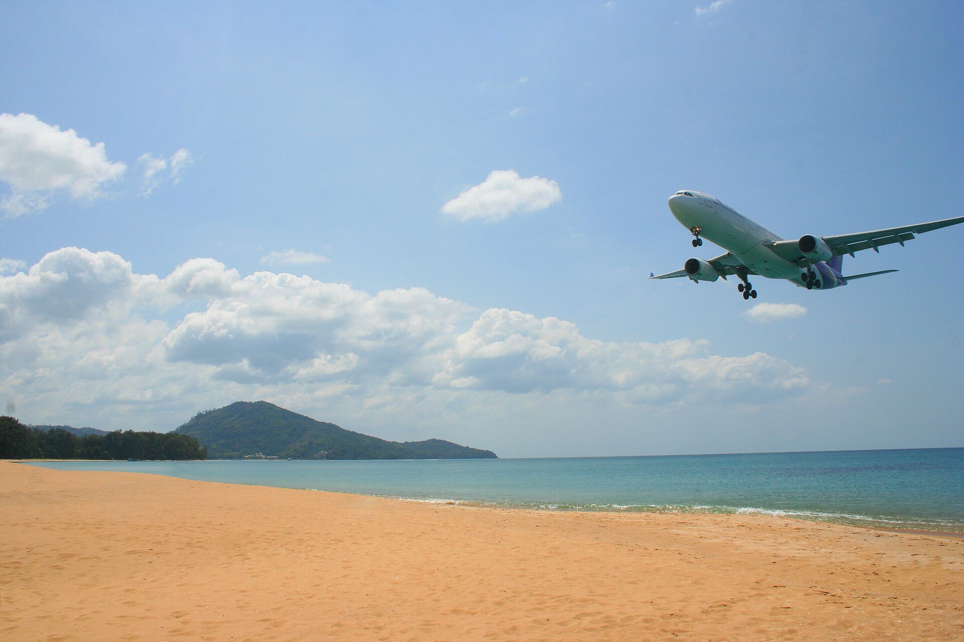 Plane over the beach near Phuket airport