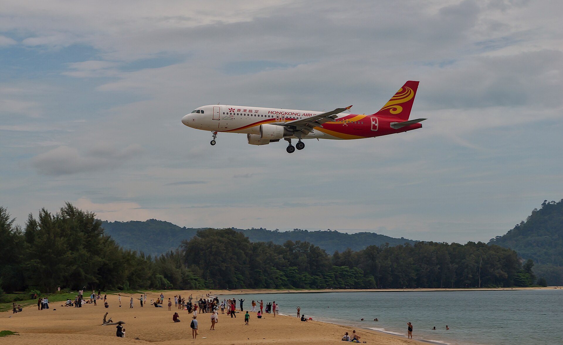 Airliner on final approach over Mai Khao Beach